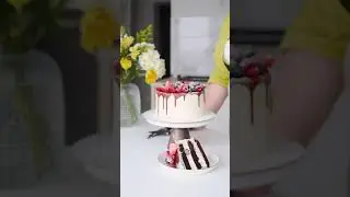 Sliced Vanilla Chocolate 🍫 with Berries 🍒 on top! #chocolatecake #berries #cakes #vanillacake