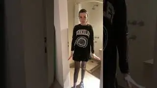 Shower fully clothed wearing two layers of shirts, skirt, tights and sneakers 