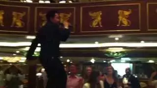 Sheward the waiter singing in the Empire dining room on the Carnival Spirit cruise ship