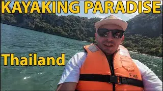 KAYAK PARADISE. Exploring the hidden cave and beach on remote tropical island, next to Koh Samui