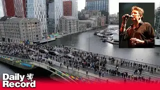 Shane MacGowan's coffin passes over Mac Mahon Bridge in Dublin - drone footage