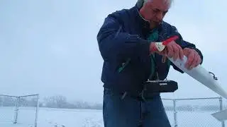 Flying an RC powered glider in a snow storm.