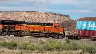 Railroad train moving along the scenic New Mexico landscape 
