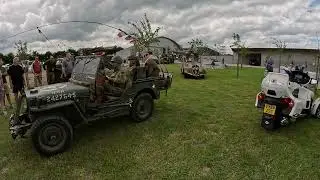 Military vehicles leaving British Memorial in Normandy, as part of D-Day 80th Anniversary.
