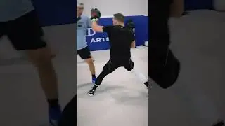 Michael Chandler hitting pads with Henri Hooft
