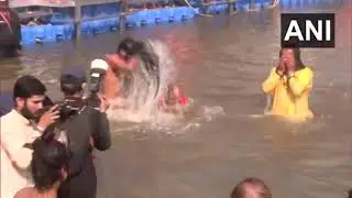 UP CM Yogi Adityanath and Yog Guru Baba Ramdev take a holy dip at Triveni Sangam in Prayagraj