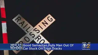 Good Samaritan Pulls Man Out Of Car Stuck On Train Tracks