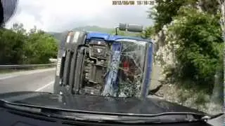 Truck tips over in curve