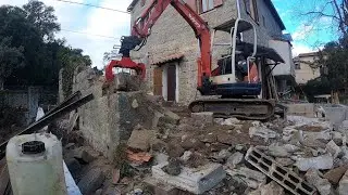Démontage du mur en pierre