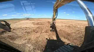 CAT 310 Excavator Digging