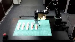 Packaging Using Robotic Arm. Pulse Cobot Packing Toothpaste