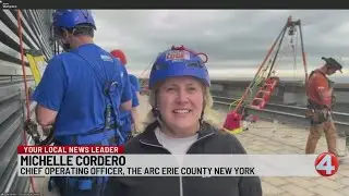People heading down Seneca One Tower for The ARC Erie County