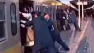 People being Cramped into a train in China