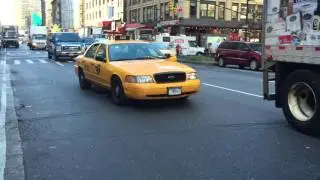 NYPD YELLOW CAB CROWN VICTORIA UNIT ON 8TH AVENUE IN THE MIDTOWN AREA OF MANHATTAN IN NEW YORK CITY.