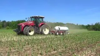 Versatile 310 Tractor pulling an Anhydrous toolbar in Twin Row Corn
