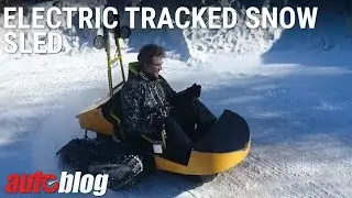 Electric tracked snow sled