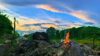 Sacred Rock Campfire by River at Peaceful Sunset