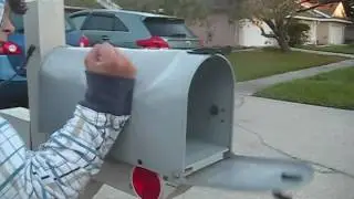 Kid punching metal mailbox with his bare hands