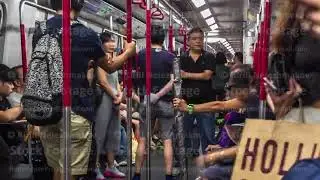 Metro train interior timelapse, carriage ride on station, outdoor lights blinking in train windows.