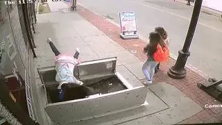 Woman falls down open sidewalk cellar door
