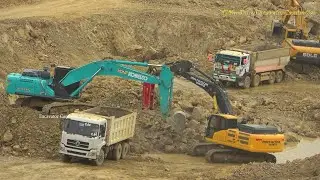 Kobelco Sk380 Excavator Clearing Rock Into Dump Truck - ​​​អេស្កាវ៉ាទ័របុកថ្ម