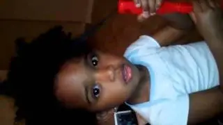 The lil GEM flat irons her Hair - LOL
