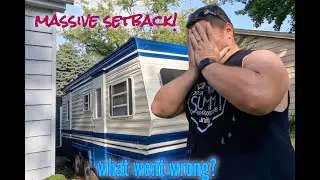 Painting the classic camper exterior.