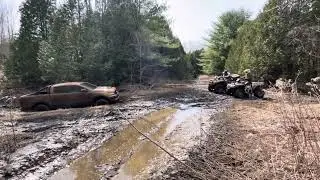 2 Arctic Cats pulling out a Ford Ranger