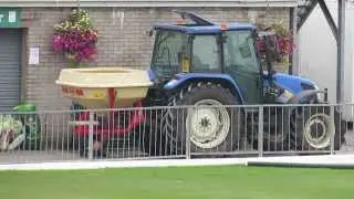 New Holland  towing a Vicon Seeder