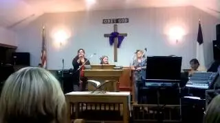 Kim casey and family singing consider the lilies