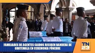 Familiares de agentes caidos reciben bandera de Guatemala en ceremonia fúnebre