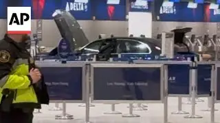 Driver crashes car into an airport entrance in the Detroit-area, injuring 6