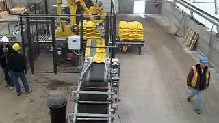 Robotic bagged salt palletizing system.  Overhead view.  Re-conditioned Fanuc 410.