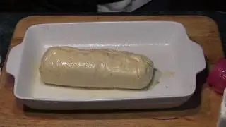 How to cook a stuffed pork tenderloin wrapped up in crescent pastry.