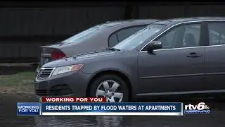 Residents trapped by floodwaters at apartments