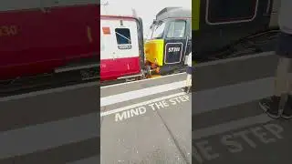 Class 69006 and class 57311 leaving Peterborough Station