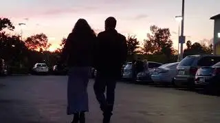 Free B-Roll - Car and Foot Traffic in Parking Lot at Twilight (2160P60)