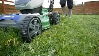 cutting grass with Powerbase battery lawn mower