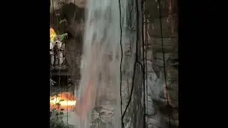 Standing inside a cave behind the waterfall at the Gaylord Palms Resort