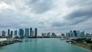As dusk settles, the cruise ship drifts away from Miami’s glowing skyline
