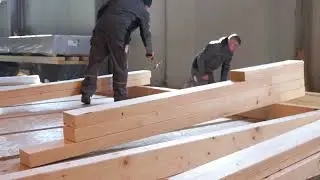 Fast forward production of a prefabricated wall with a wooden structure.