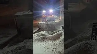 Tractor Snow Blower Clearing Parking Space