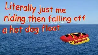 Riding an inflatable hot dog then falling off