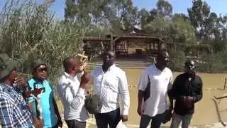 'What a Mighty God We Serve', a group of Christian sings in the place where Jesus was baptized