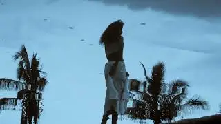Woman Spinning in Water Reflection