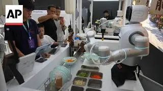 Humanoid robots perform tasks at the World Robot Conference in China