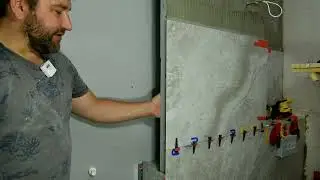 Облицовка стены керамогранитом 60*120 из 9 плоскостей. Укладка плитки в санузле. Плитка под ключ.