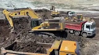 Caterpillar 365C And Caterpillar 365B Excavators Loading Trucks