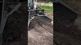 Bobcat Loader working with Asphalt Spreader