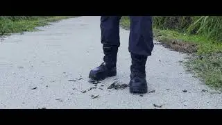Combat boots crush beer bottle